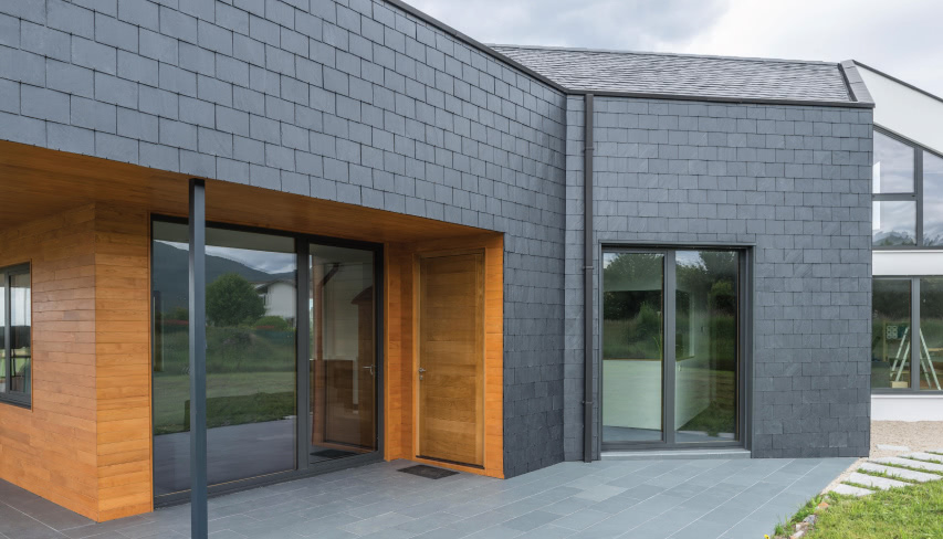 bioclimatic house with a slate facade in Spain
