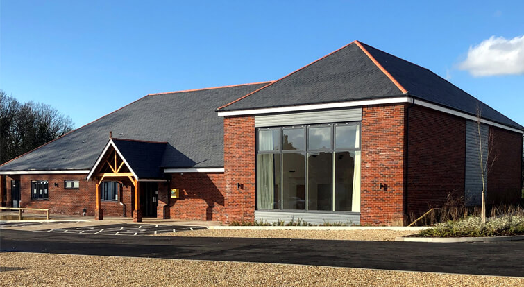 New village hall in Thakeham, slate pitched roof